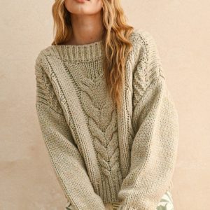 Sweater crema trenzas
